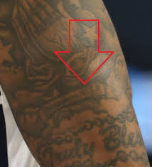 Grey shaded joined hands with celtic cross blessed tattoo on arm. Bradley Beal S 26 Tattoos Their Meanings Body Art Guru