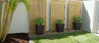 Note how the homeowner has placed taller plants in the center of these areas and surrounded them with colorful flowers closer to the ground. Decorative Bamboo 40 Ideas For A Garden Decor With Bamboo A Spicy Boy