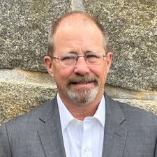 Receiving a coin from the CNO in advance of my retirement.