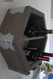 The wine rack is made in metal and looks just as much as a sculpture as a wine rack. Hex Wine Wine Glass Holder Rogue Engineer