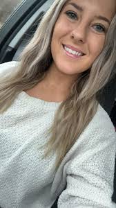 Wavy bob with icy blonde highlights and warm caramel lowlights for a  multi-tonal look.