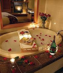 The bathroom tub is surrounded by candles, plants and even picture. 21 Romantic Baths Ideas Romantic Bath Romantic Bathrooms Bath Candles