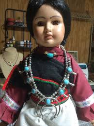 Who made the child's squash blossom doll and what other items did they  create?