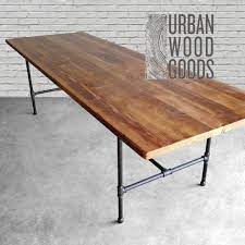 Our reclaimed barnwood farm table with tapered legs and country windsor chairs. Wood Dining Table With Reclaimed Wood Top And Iron Pipe Legs Etsy