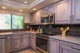 A Kitchen Remodel In San Diego California Features Starmark Cabinetry S Ridgeville Door Style In Cherry In A Cu Kitchen Remodel Custom Kitchens Grey Kitchens