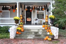 Thisspooky halloween porch decor includes a large tree branch with blackbirds. 20 Simple But Effective Halloween Front Porch Ideas