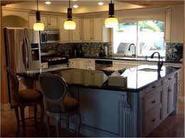 This bright kitchen has two islands with a wider top to dine and work on, and a slimmer one to prep ingredients on. L Shaped Kitchen With Island Cost 2 Tier Kitchen Island Ideas Kitchenislandideas Freestanding Kitchen Island Curved Kitchen L Shaped Kitchen