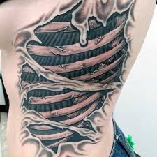 Top 49 Ripped Skin Tattoo Ideas 2021 Inspiration Guide Ripped Skin Tattoo Skin Tear Tattoo Flesh Tattoo