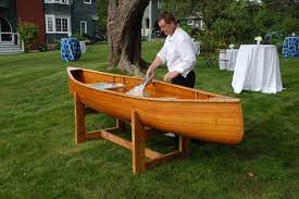 Rustic Beer Canoe Being Filled With Ice For A Seaside Wedding Reception Canoe Wedding Beer Wedding Tent Decorations