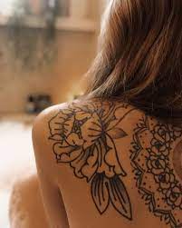 Stylish floral design watercolor tattoo ink on back shoulder for trend setting girls. Updated 65 Graceful Shoulder Tattoos For Women August 2020