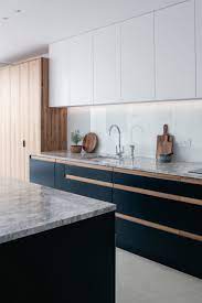 Deep Blue Bespoke Kitchen Cabinets With Satin Walnut Recessed Handles Brazilian Quartzite Wor Bespoke Kitchen Cabinets Interior Design Kitchen Kitchen Remodel