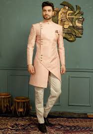 We bring you an exhaustive range of indian wedding dresses for men from the best of ethnic brands. Art Silk Jacquard Sherwani In Pink This Readymade Attire With Satin Lining Is Enhanced With Buttons And Poc Groom Dress Men Wedding Dress Men Wedding Suits Men