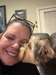 This week's banner photo is Nikki's photo of Dan painting Koda. The banner  shot format (if any admins know how to adjust the banner so that Dan's  expression is included, I would