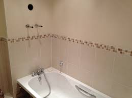 paint from the wall before tiling