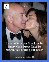 Lauren Sanchez dazzled in an eye-catching dress at a recent event, but even  her sparkle wasn't enough to keep the attention of her fiance, Jeff Bezos.