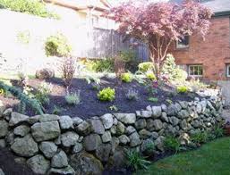 Select boulders with a flat 'top for comfortable lounging. Landscape Ideas Walls