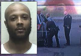 Man being questioned in shooting death of hotel clerk identified