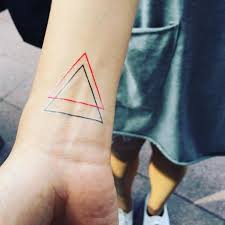 Want to see the world's best thin blue line tattoo designs? Red Ink And Black Ink Triangle Thin Line Tattoo On Wrist Tattooimages Biz