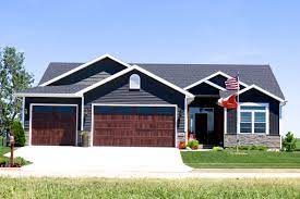 Garage doors offered at low prices free shipping*. Ironstone Grey Siding With White Trim Black Roof And Faux Wood Garage Doors In Normal Il Carlson Exteriors Inc