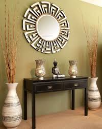 To personalize the nook she spruced up the table with a ceramic vase and a couple of candlestick holders. 11 Ways To Decorate The Entryway With Floor Vases