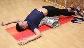 Setu Bandha Sarvangasana Supported Bridge Pose With Bolster Yoga For Beginners Restorative Yoga Poses Yoga Props
