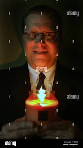 A.I. Root president Brad Root is illuminated by one of the manufactured  candles, during a tour of the A.I. Root Candle facility in Medina, Ohio,  Friday, October 2, 2009. (Photo by Paul