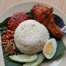 Fairus seen here is responsible for preparing your nasi lemak. Nasi Lemak Ayam Berempah Asnaf I Care