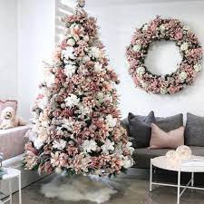 Blush pink flowers for xmas tree. This Trend Has Us Swapping Garland For Gardenias And We May Never Go Back Christmas Floral Christmas Tree Elegant Christmas Trees Pink Christmas Decorations
