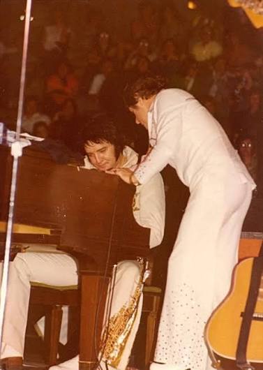 Elvis looks exhausted in 1977 concert photo
