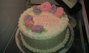 Place the oval cake on your cake plate or cake stand and cover in a thin layer of chocolate buttercream. Mother S Day Cake Sweet Adventures With Amy