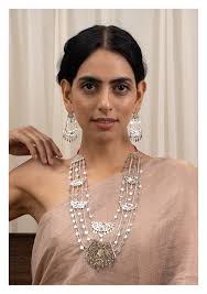 Silver jewelry is one of the most beautiful and versatile in a collection. Indrani Silver Necklace Earrings Set