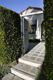 You see a wooden fence gate in the settlement of.. Hardscaping 101 Design Guide For Paths And Pavers Gardenista