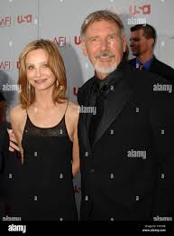 Actor Harrison Ford and his girlfriend, actress Calista Flockhart, arrive  for the taping of the 