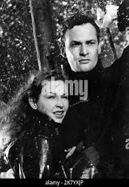 Film still from 'The Young Lovers' starring Paul Carpenter, Theodore Bikel,  David Kossoff, and Odile Versois Stock Photo