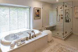 The stunning sconces and sleek faucets are the perfect finishing touch to this large bath. Luxury Bathroom Remodel Ideas Owings Brothers Contracting