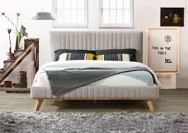 Bed frame includes wooden slats and natural wood finish legs. 11 Chic Mid Century Beds That Ll Complete Your Bedroom Posh Pennies