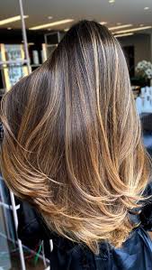Embrace yours with all the energy you have got and add some pastel highlights the choppy pixie is a great way to look pretty young when you are in your sixties. Best Hair Colours To Look Younger Caramel Highlights For Long Layers
