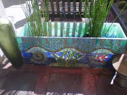 It's not a fish tank but it reminds me of one and i really loved the gold edges. Salvaged Plexiglass Fish Aquarium With Mosaic Repurposed Into A Planter Outdoor Fish Tank Fish Tank Repurpose Fish Tank Repurpose Ideas