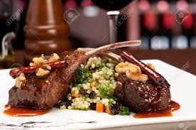 If you love spices, try indian style spiced lamb chops championing all those characteristic spices like garam. Close Up Of Lamb Chops With Couscous And Vegetables With A Sauce Stock Photo Picture And Royalty Free Image Image 5657394