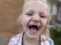 I'm a lucky kid': The Booker family fills their house, hearts through  adoption