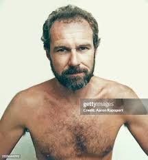 Art Director John Kosh poses for a portrait