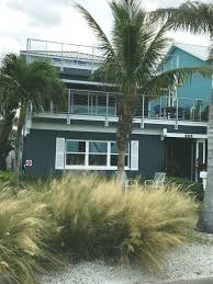 Choose a paint color scheme in eggshell, mushroom or taupe for the stucco, and add a chocolate brown for contrast on the trim. Coastal Cottages By The Sea Beach Condo Rentals St Petersburg Florida And Bodega Bay California