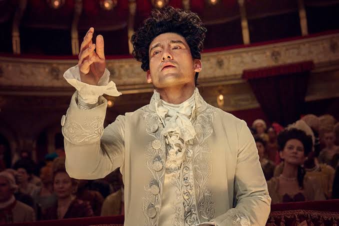 Amadeus' Teaser: Will Sharpe's Mozart, Paul Bettany's Salieri Face Off