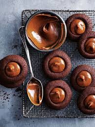 Tempting Chocolate Cookies With A Dollop Of Caramel In The Middle What More Could You Want Thumbprint Cookies Desserts Chocolate Caramel
