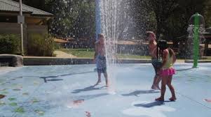 Happy kid playing in water fountain at water park. Three Children Playing In Water Fountain Stock Video Pond5