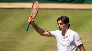 Fritz impresses with his walk-on before advancing at Wimbledon