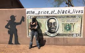 Black spray paint was used to deface the sculpture and cover text on the pedestal. How Phoenix Artist Bacpac Fixed Her Vandalized George Floyd Mural Phoenix New Times