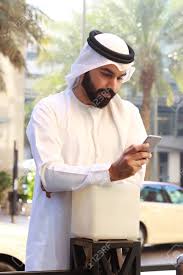 Performs like a wax/gel and at the same. Arab Man Using Mobile Phone Wearing Uae Traditional Dress Stock Photo Picture And Royalty Free Image Image 99490292