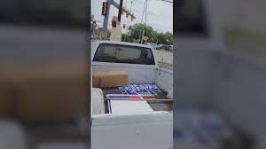 Two candidates running for District seven are at odds over a campaign sign