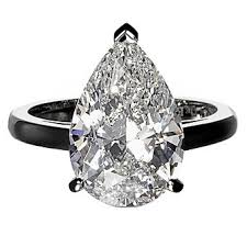 De Beers Platinum Engagement Ring With A Pear Shaped Solitaire Pear Diamond Engagement Ring Fashion Rings Simple Engagement Rings